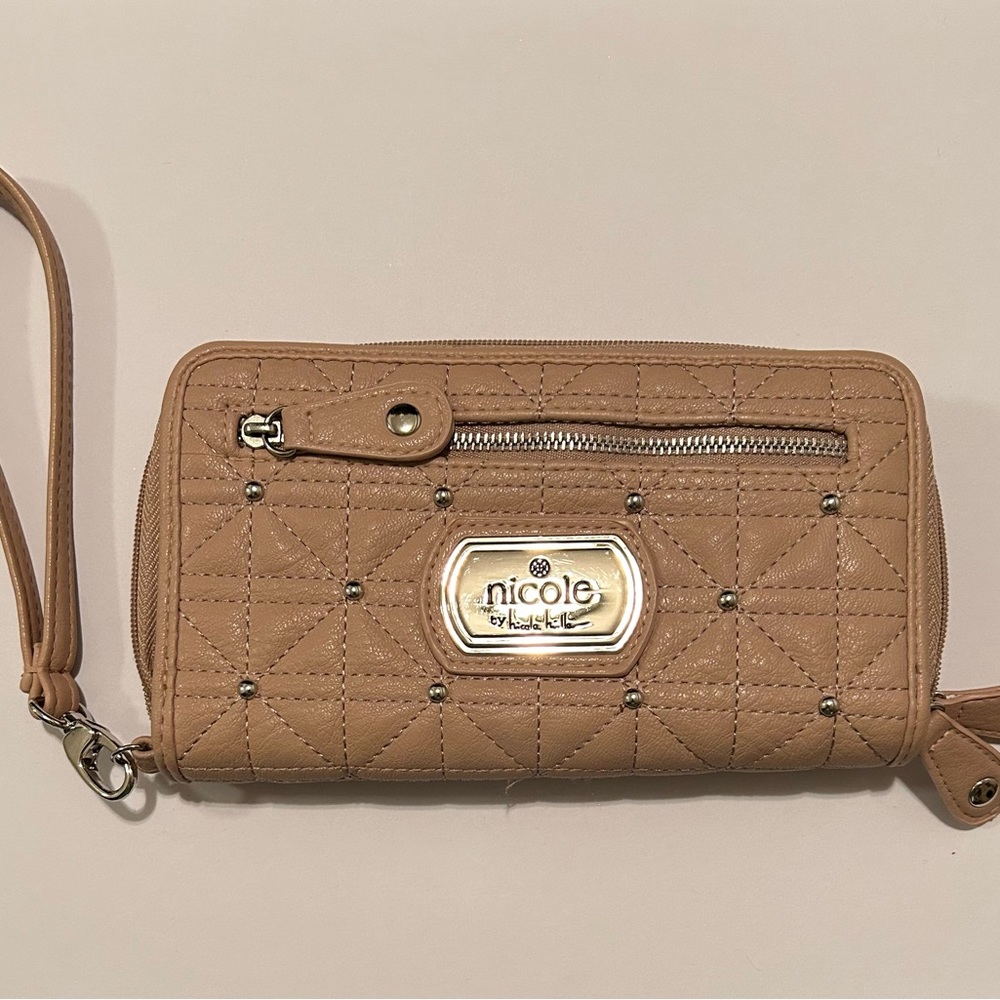 Nicole Miller tan wristlet wallet.